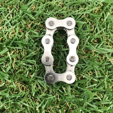 Kaiko Chain Link Fidget on the grass